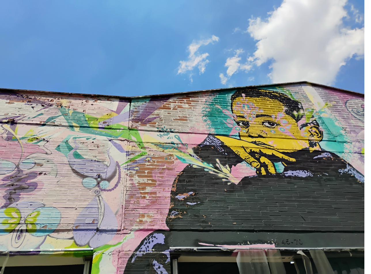 Child portrait mural with pastel flowers