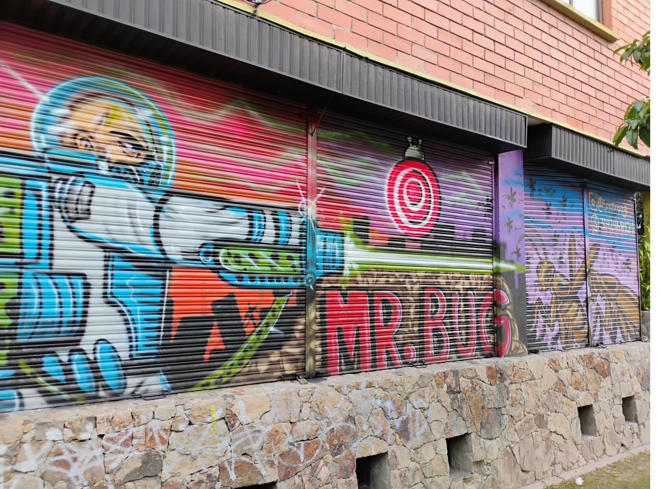 Mr. Biz astronaut mural on shutters