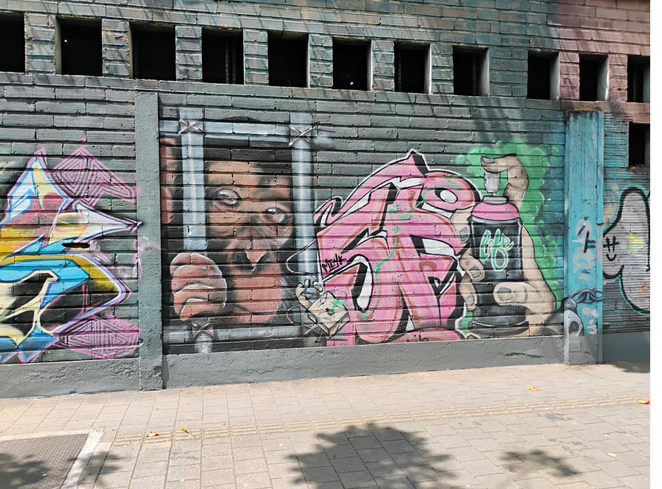 Spray can character mural — The Artist