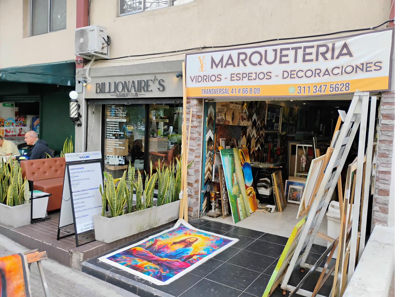 Marquetería storefront — Billionaire's Barber + frame shop